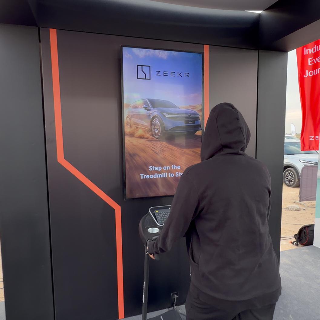 Interactive Treadmill Activation in Dubai: Participants generating human power to recharge EV cars